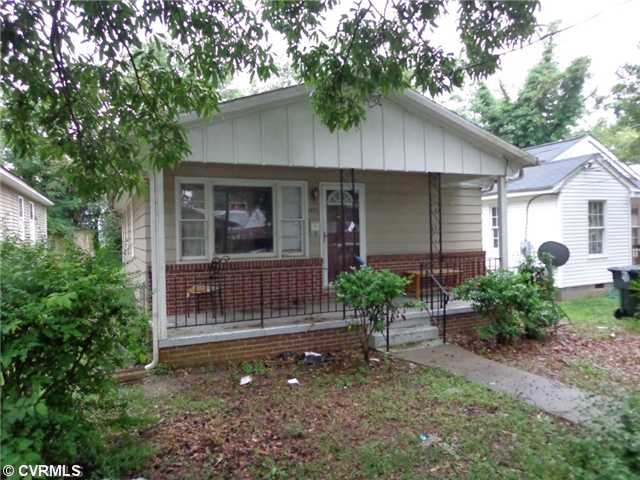 Exterior Front - Covered front porch with some wit