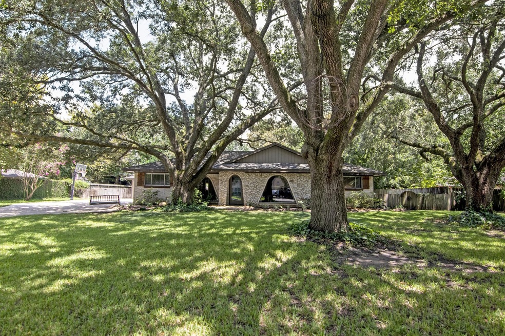 508 Misty Ln, a Beautiful Wooded 3/2/2 in the Heart of Friendswood, FISD School!