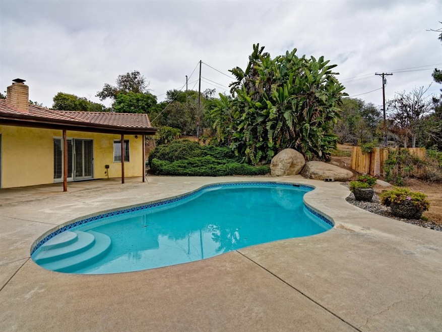 Newly re-plastered pool, with patio and fire-pit.
