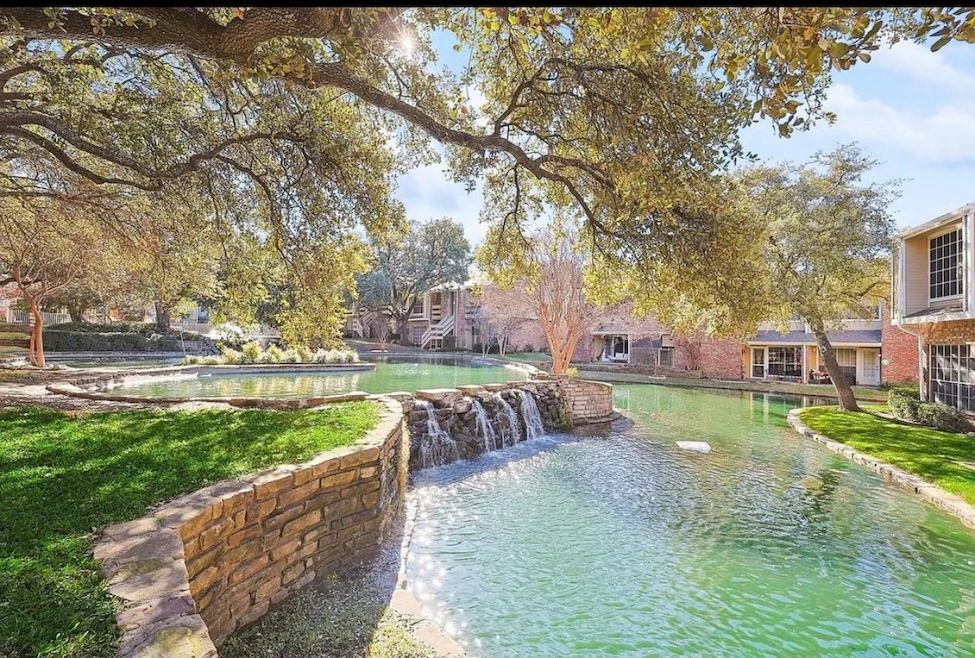 View of home's community featuring a lawn