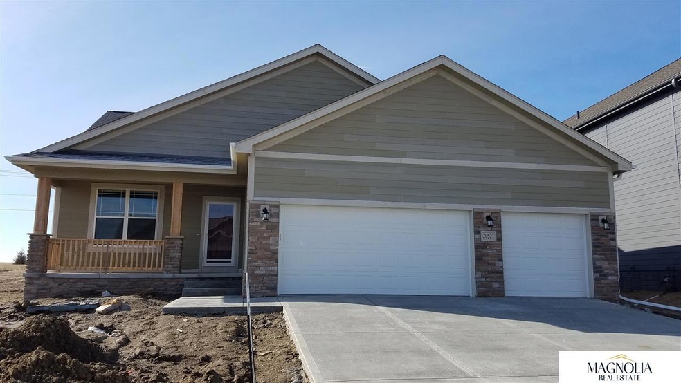 full front porch, 3-car garage, James Hardie siding & amazing Elkhorn South location.  Exterior paint, full sod & sprinkler system coming soon!