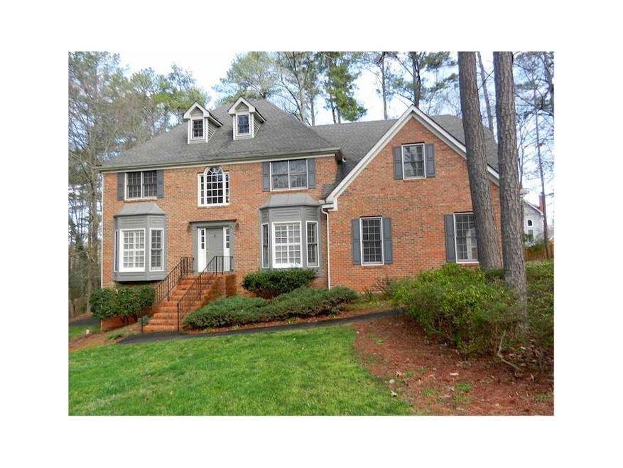 Exterior Front. Three sided brick, side entry gara