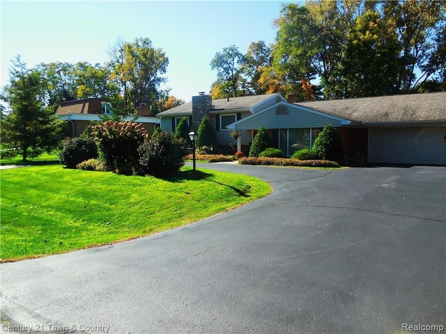 Circular driveway and mature landscaping