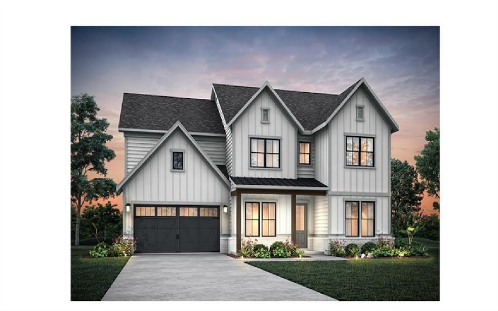 Modern farmhouse style home with roof with shingles, concrete driveway, a lawn, and board and batten siding
