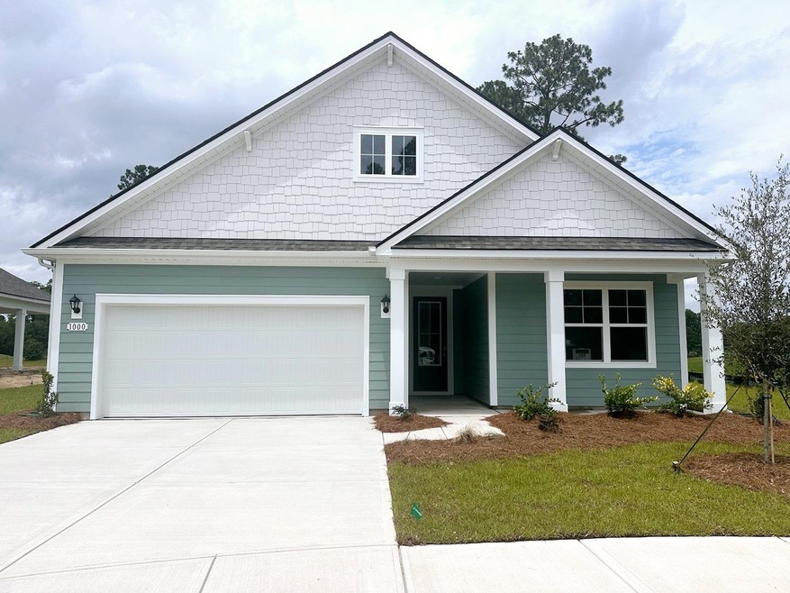 View of front of property with a garage and a fron