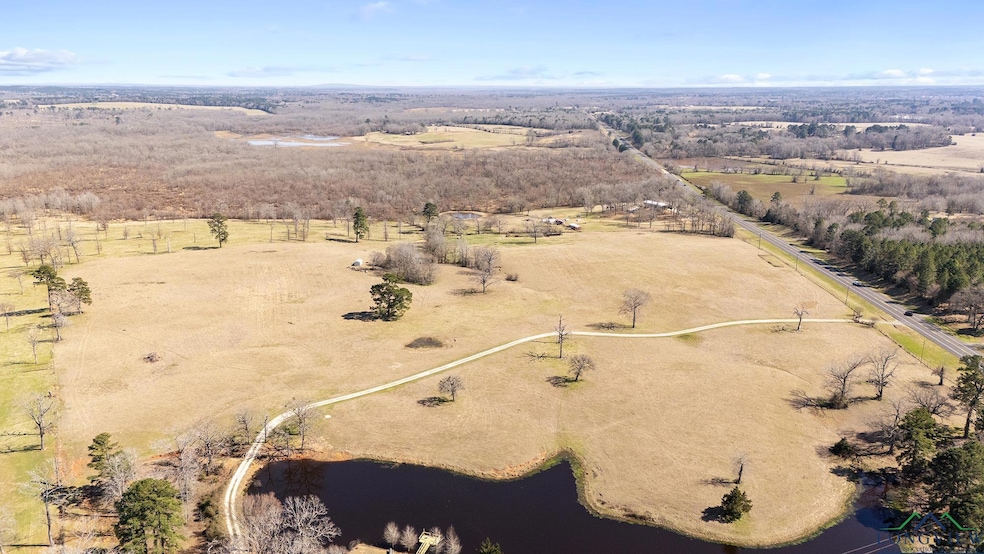 Bird's eye view with a water view and a rural view