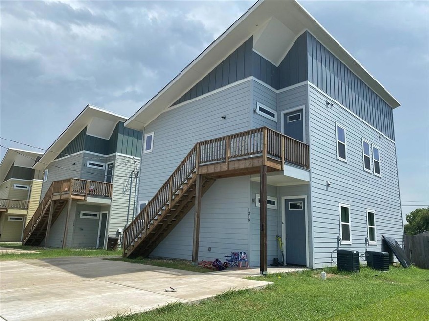 Rear view of house featuring board and batten sid