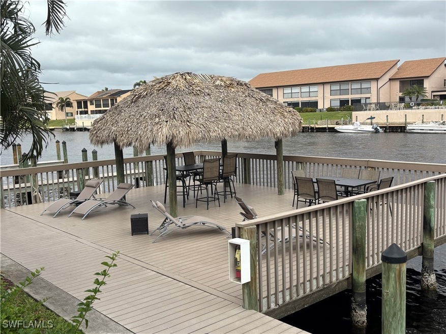 Community deck with Tiki hut and lounge chairs are
