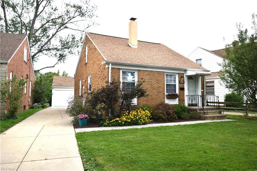 View of property with brick exterior