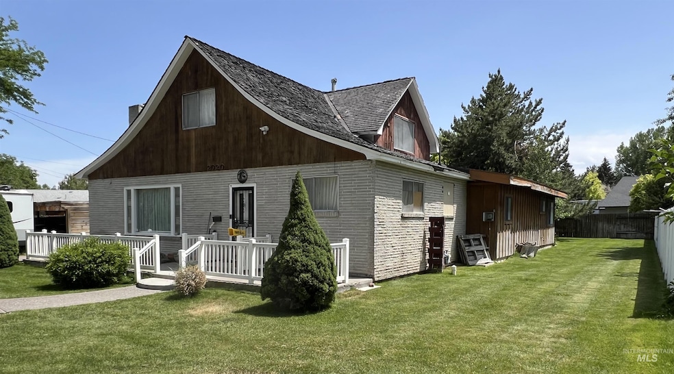 Rear view of property featuring brick siding