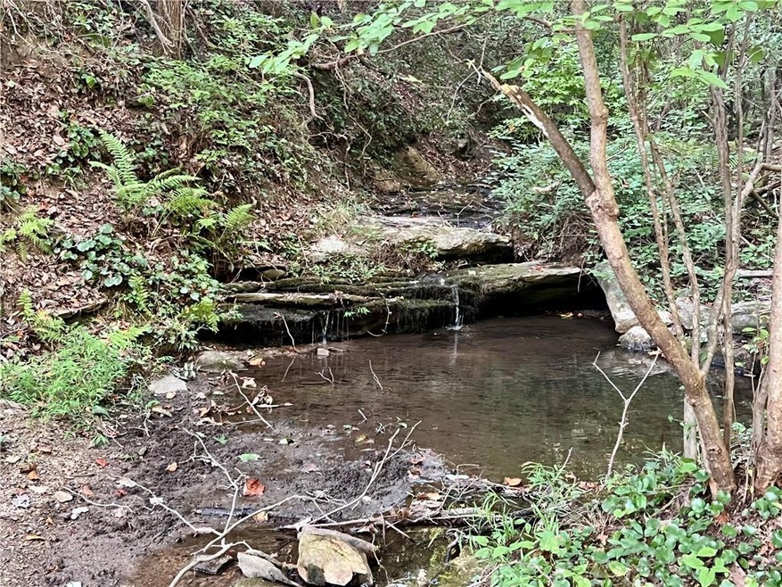 Come sit by the babbling creek.