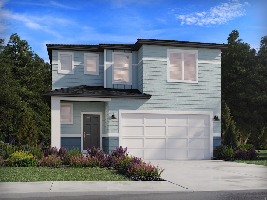 View of front facade featuring driveway and an attached garage