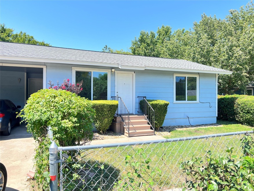 Ranch-style home featuring roof with shingles