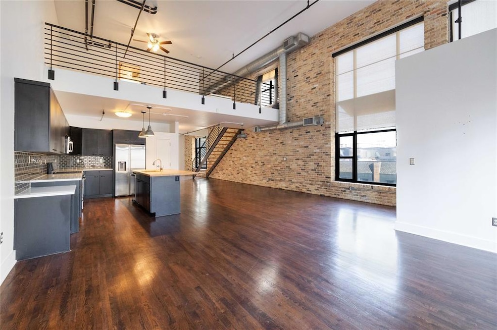 Kitchen featuring built in fridge, dark wood-styl