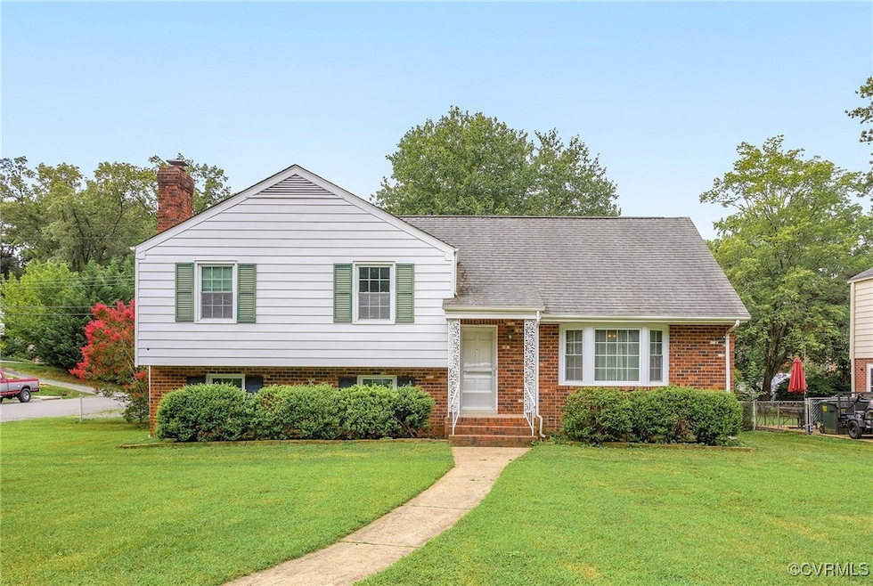 Tri-level home featuring brick and aluminum siding