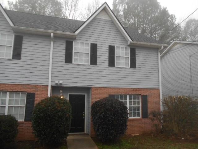 View of front of property with brick siding