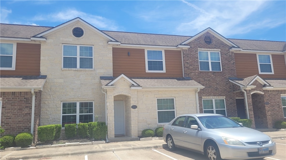 View of front of property featuring roof with shin