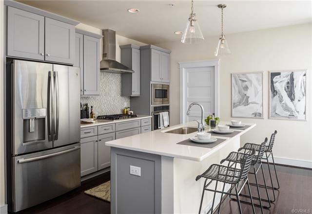 Gourmet kitchen with GE Profile appliances. Wall oven and extended, walk-in pantry.