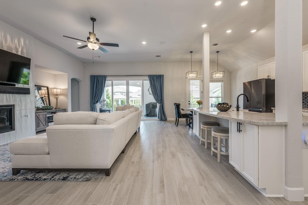 Living room with recessed lighting, light wood-st