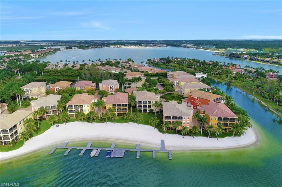 Rear view of condo with largest grassy lawn and be