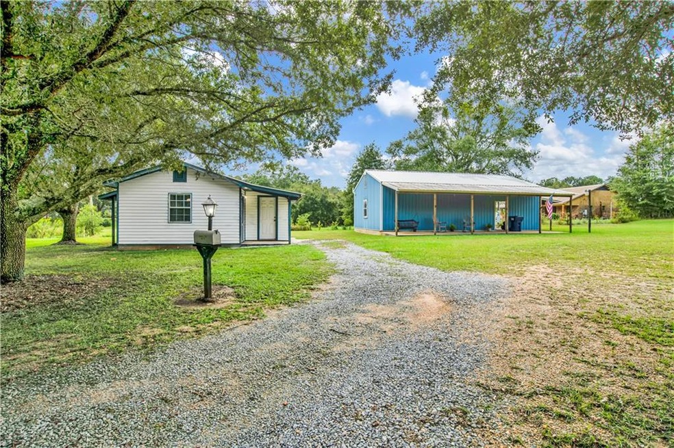View of front of house featuring an outbuilding an