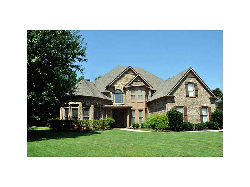 Exterior Front. All Brick with three car side entr