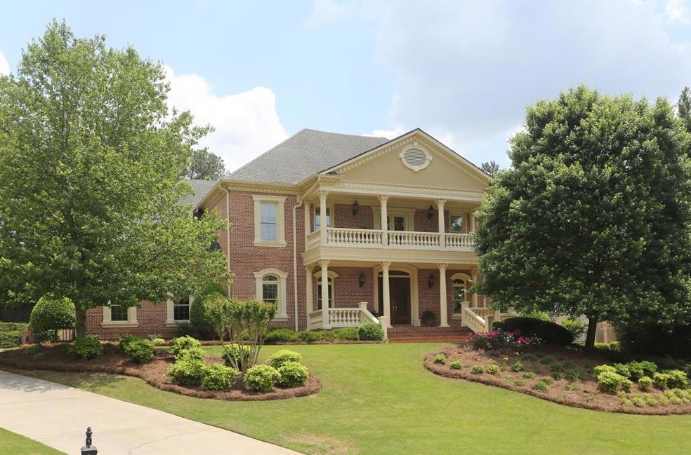 Magnificent executive 4-sided brick beauty in gate