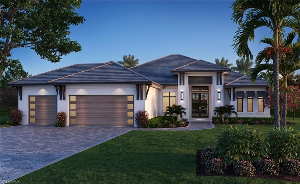 View of front facade with a garage, decorative dri