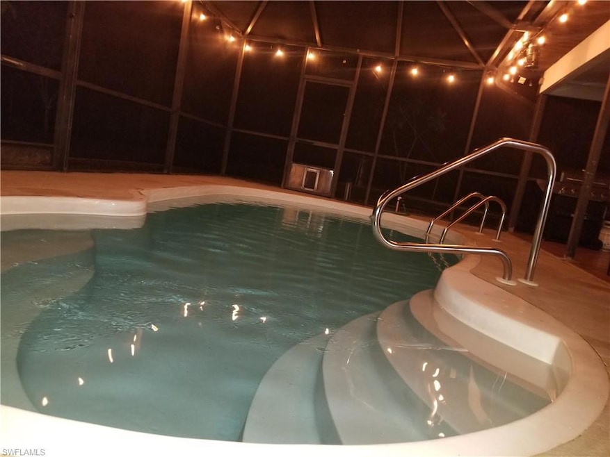 View of swimming pool featuring a jacuzzi