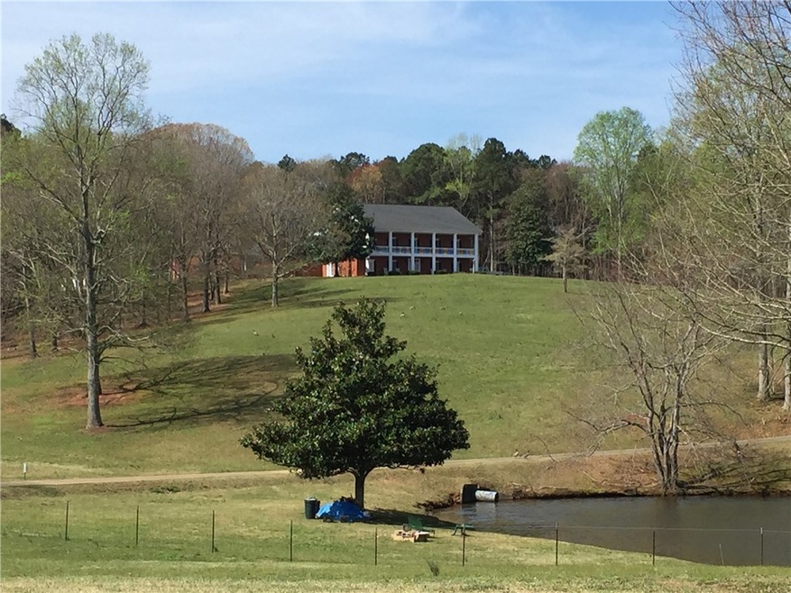 Awesome setting on this beautiful farm! Main house