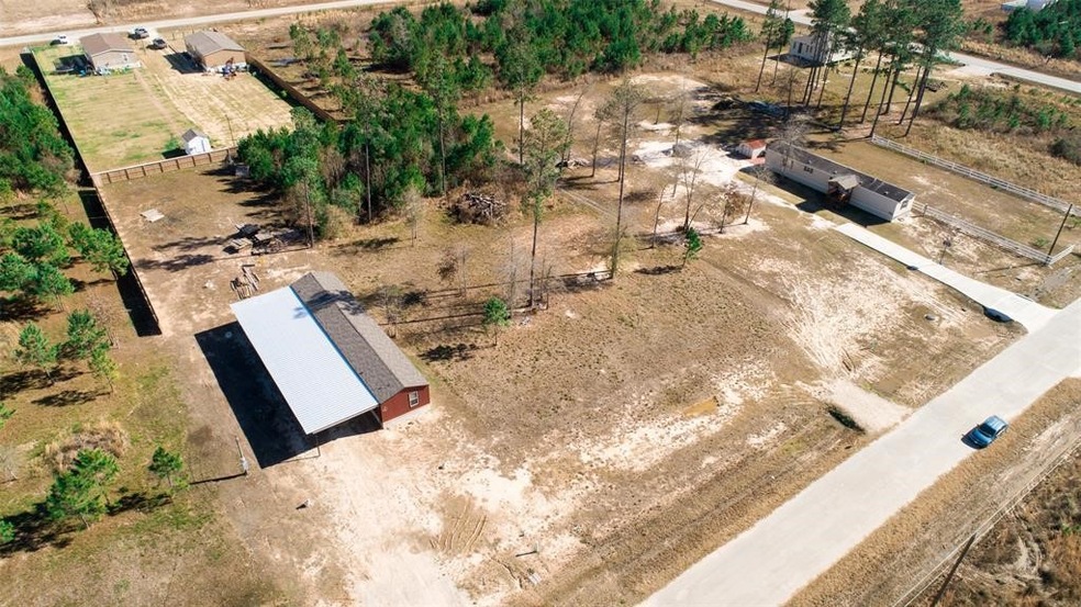 Lot #82 is for sale near the red mobil home.