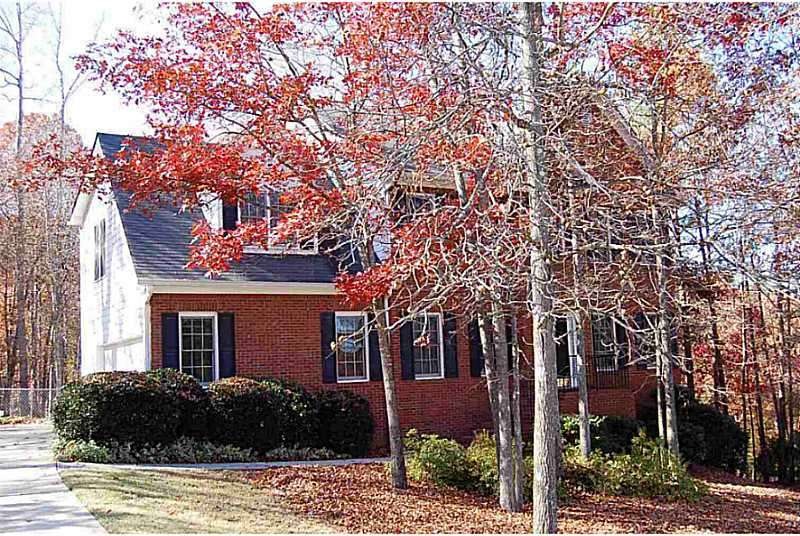 Exterior Front. Pristine brick & concrete sided ho