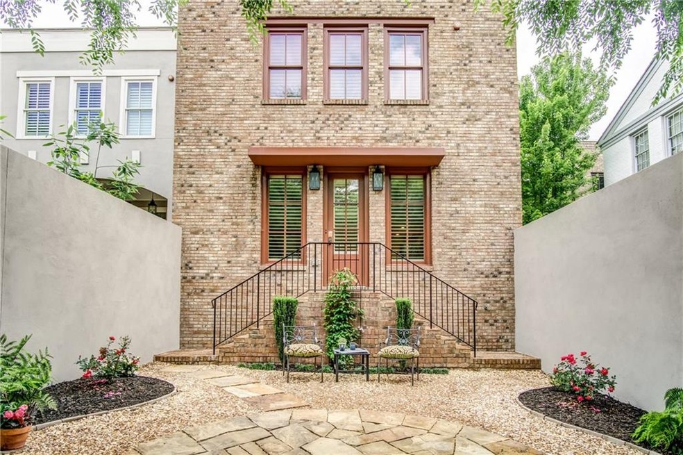 Stunning end unit townhome with intimate courtyard