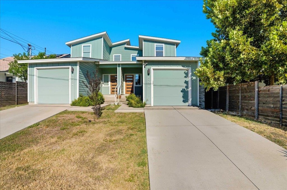 View of front of home with concrete driveway, a porch, and a garage