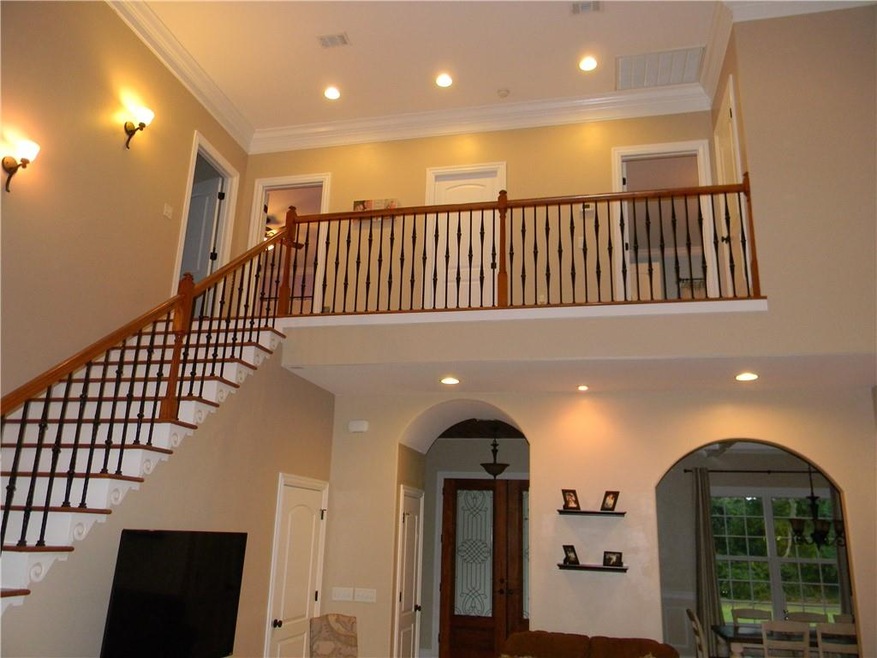 Dramatic two-story open living area/.  Open stairc