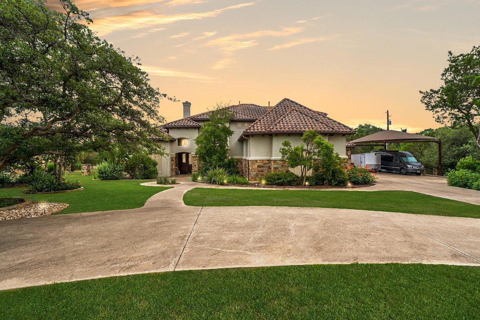 Mediterranean / spanish home with driveway, stucc