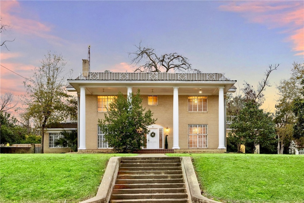View of front of property with a yard