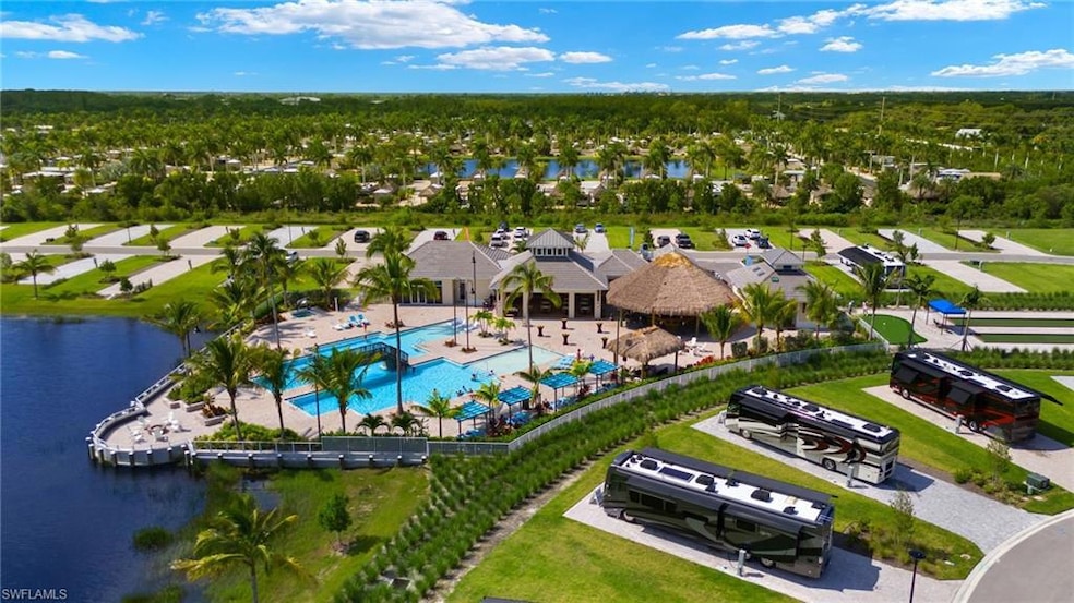 Birds eye view of property featuring a residential view and a water view