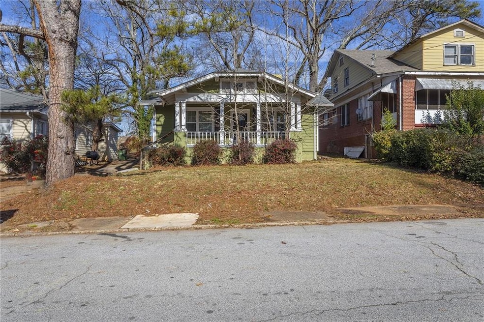 Bungalow-style house featuring a front yard and a 