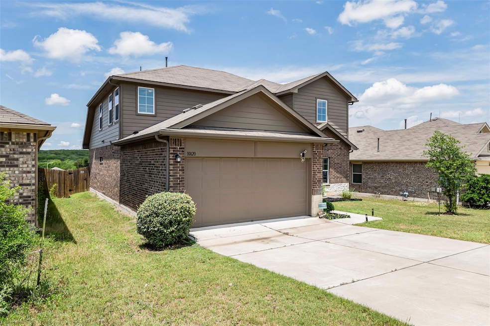 Traditional-style house featuring brick siding, c