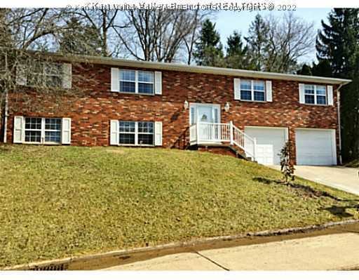Exterior Front. Brick Front, Vinyl Sides, Over-siz