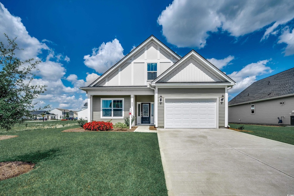 Craftsman-style house featuring a front yard and a