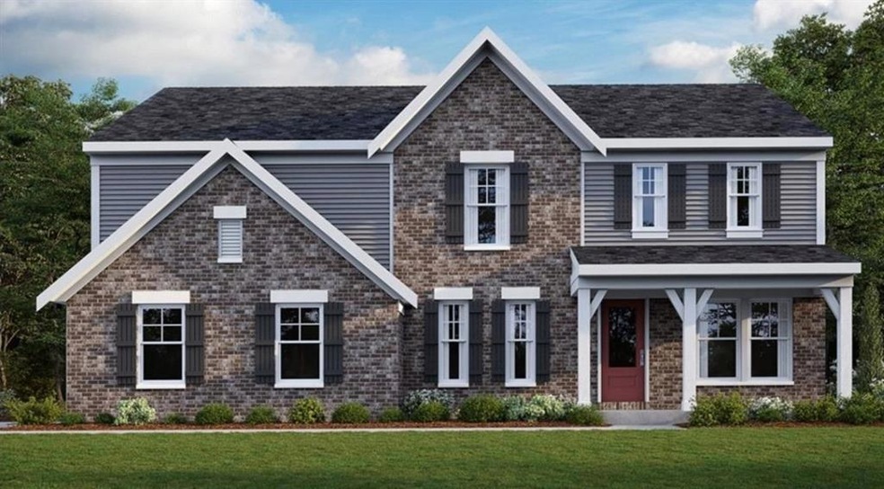 View of front of property featuring a front yard and brick siding