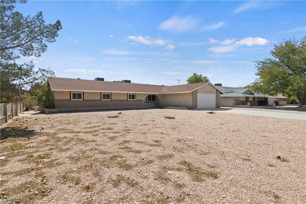 1-story ranch with gated RV parking on .46 acre lo