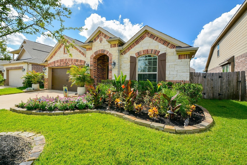 Welcome home to 13023 Ambrose Reach with impressive curb appeal!