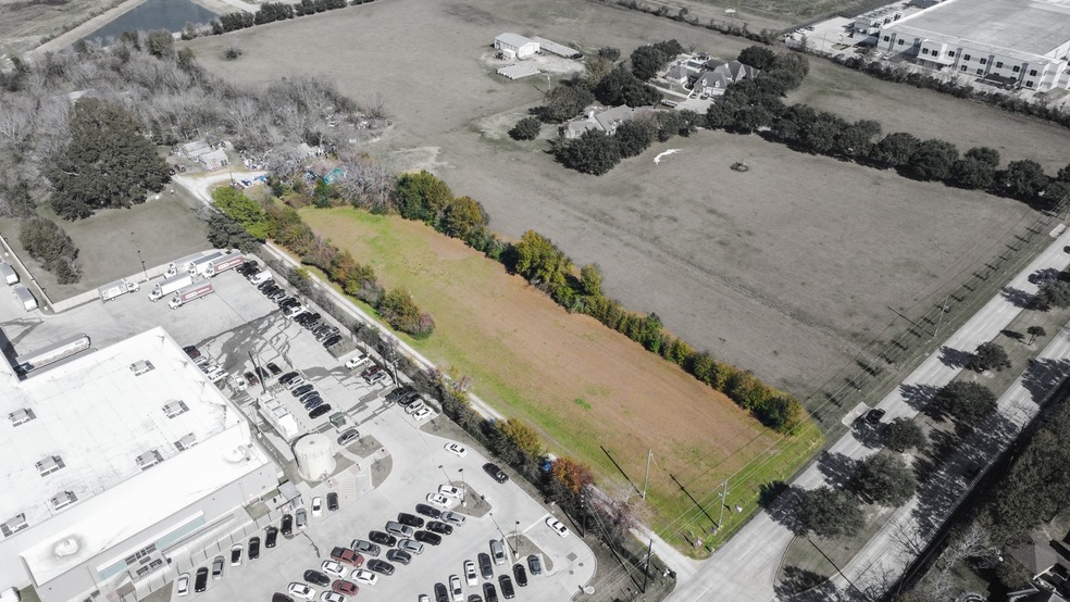 This expansive 43,649 square foot lot is ideally s