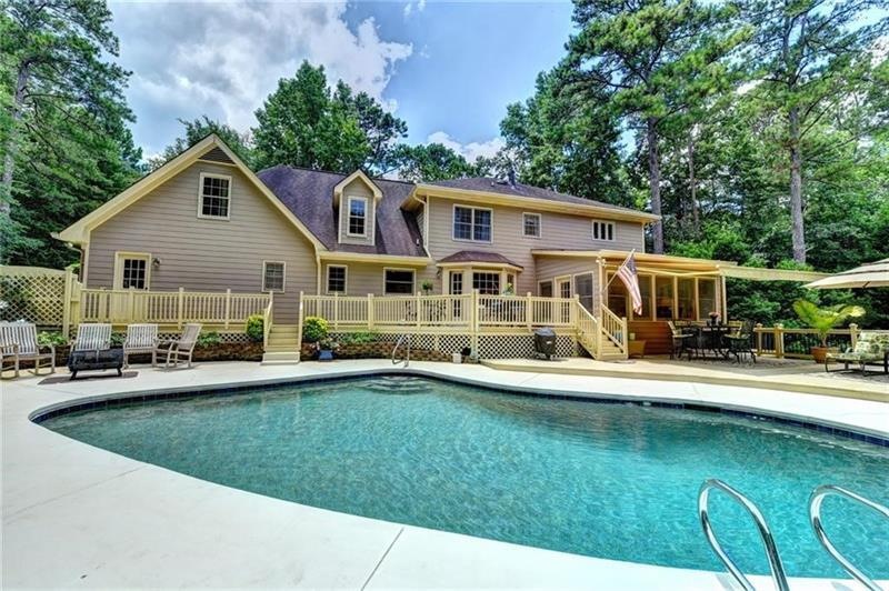Your private oasis on 1.6+ acres with walk-out to 