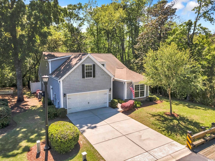 View of front of property with concrete driveway, 