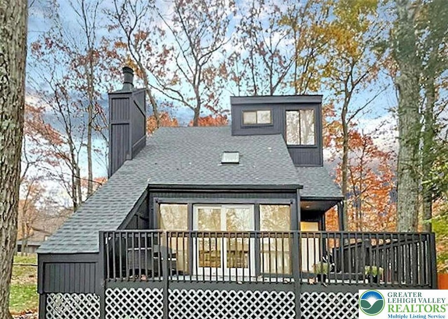Front of property and balcony view