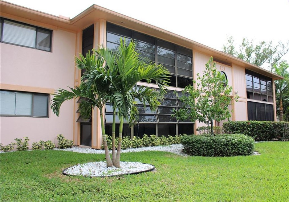First Floor unit with tropical landscpae